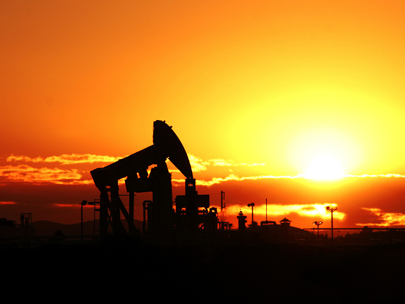 oil wells at sunset